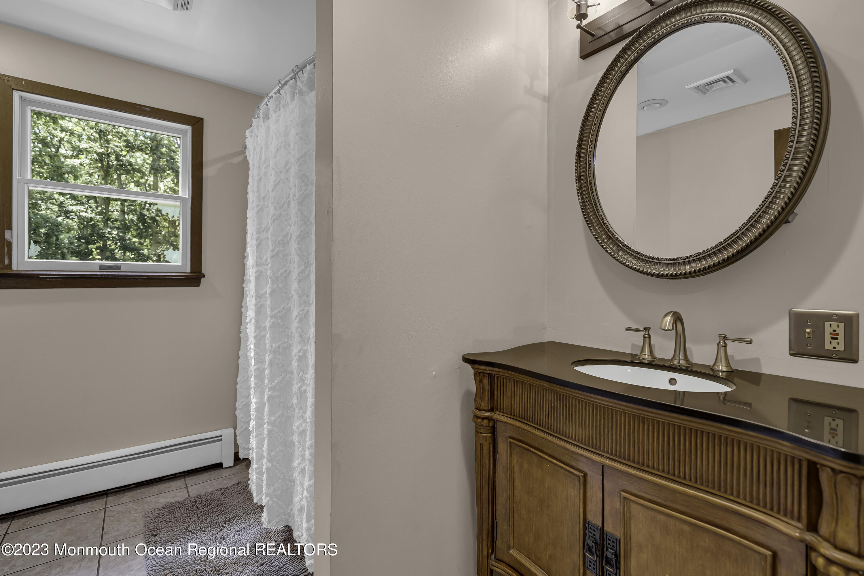 26 Frank Applegate Road Jackson, NJ 08527 - Photo 10 of 16 a bathroom with a sink and a mirror
