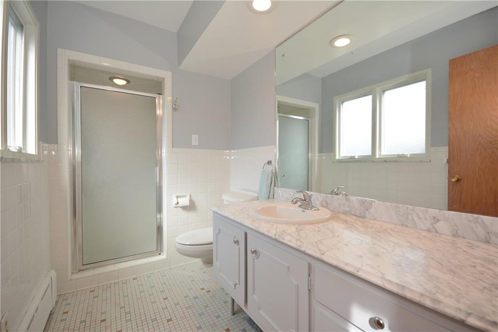 1745 Partridge Run Road Pittsburgh, PA 15241 - Photo 14 of 25 The master bath is in excellent condition and features a marble topped vanity, white ceramic tile walls, mosaic tile floor and a walk in shower.