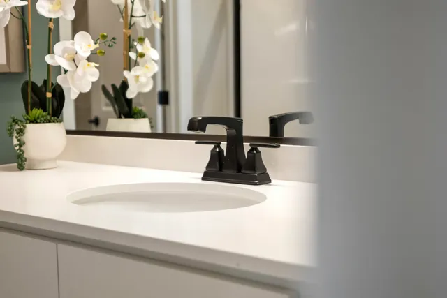 a view of balcony with furniture and potted plants