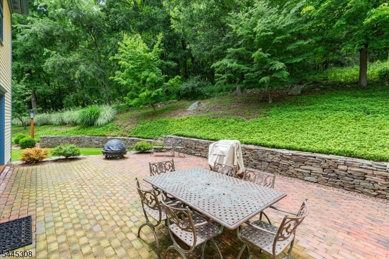911 Ravine Road Port Murray, NJ 07865 - Photo 30 of 50 a view of a patio with a table chairs and a yard