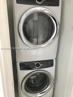 1451 Brickell Avenue, Unit 2102 Miami, FL 33131 - Photo 11 of 14 a utility room with dryer and washer