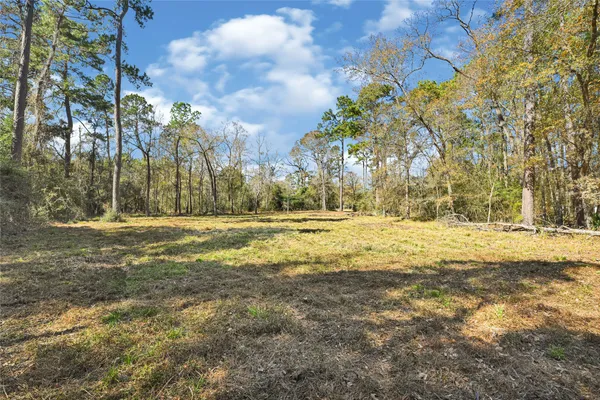 a view of a swimming pool with an outdoor space and seating area