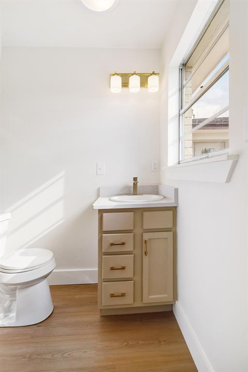 175 Cozy Lane Paris, TX 75462 - Photo 12 of 21 a bathroom with a sink toilet and window