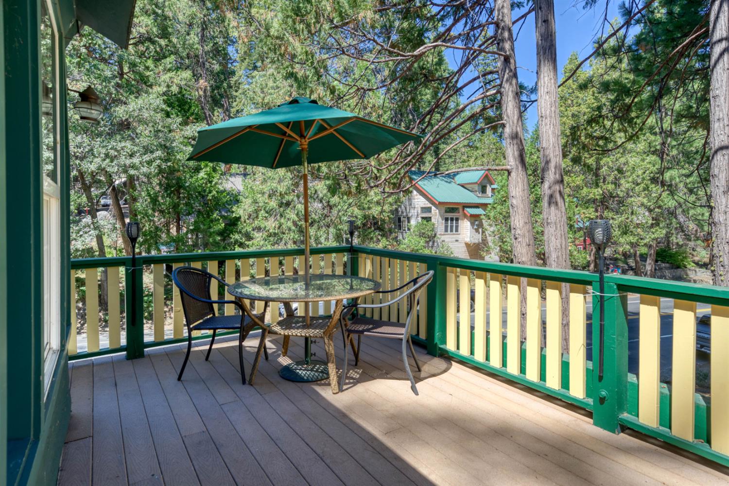 42025 Tollhouse Road Shaver Lake, CA 93664 - Photo 15 of 64 a view of a chairs and table in the balcony