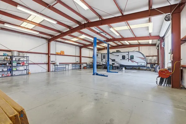 an aerial view of a house with a swimming pool