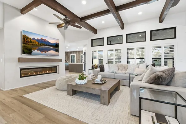 a view of cabinets a wooden floor and a window
