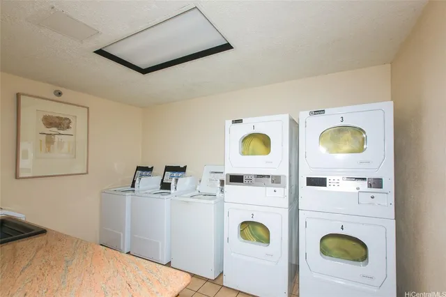 a bedroom with a bed and painting on the wall