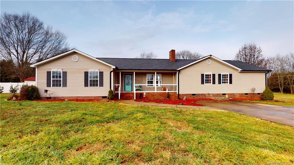 960 George Brown Road Crouse, NC 28033 - Photo 1 of 31 a front view of a house with a yard and garage