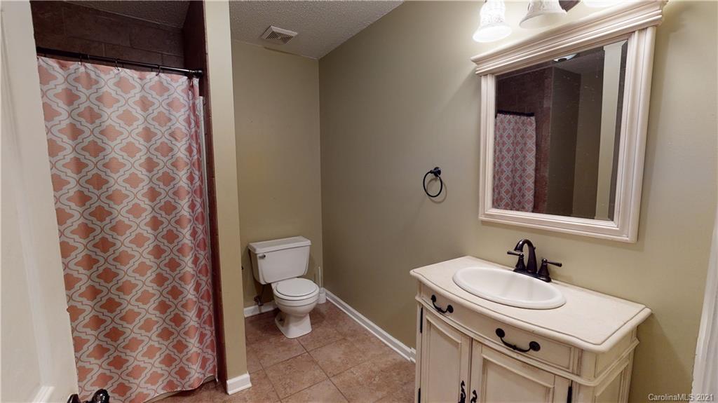 960 George Brown Road Crouse, NC 28033 - Photo 21 of 31 a bathroom with a sink toilet and mirror