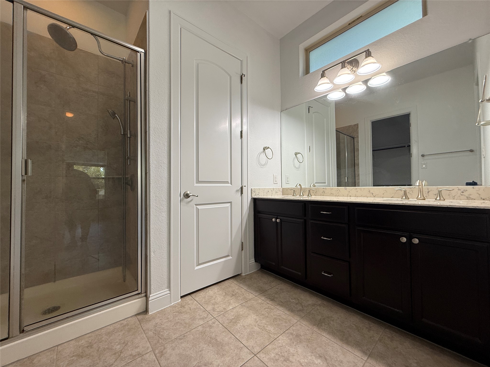 1512 Long Shadow Lane Georgetown, TX 78628 - Photo 12 of 19 a bathroom with a granite countertop sink mirror and shower