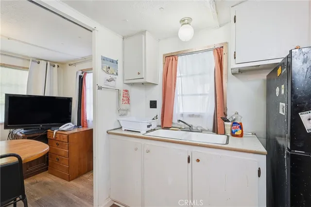 a bathroom with a sink a mirror and a shower