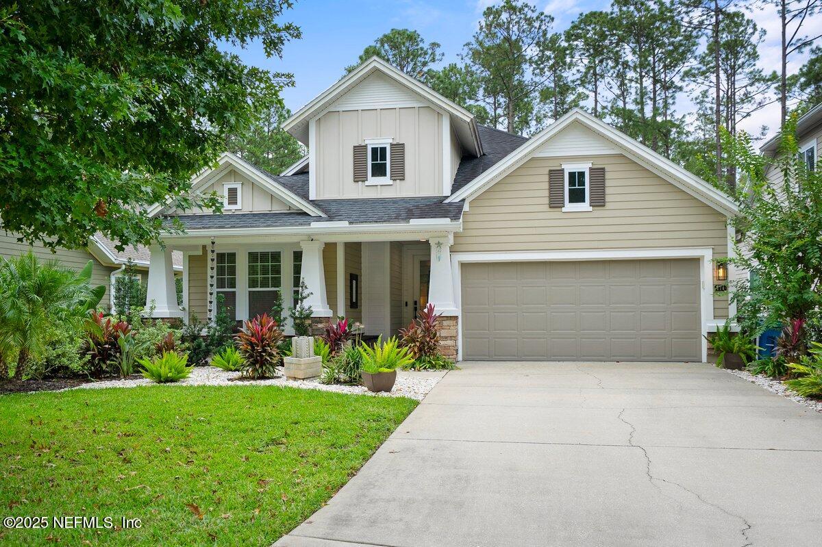 174 Beartooth Trail Ponte Vedra, FL 32081 - Photo 1 of 29 a front view of a house with a garden and plants