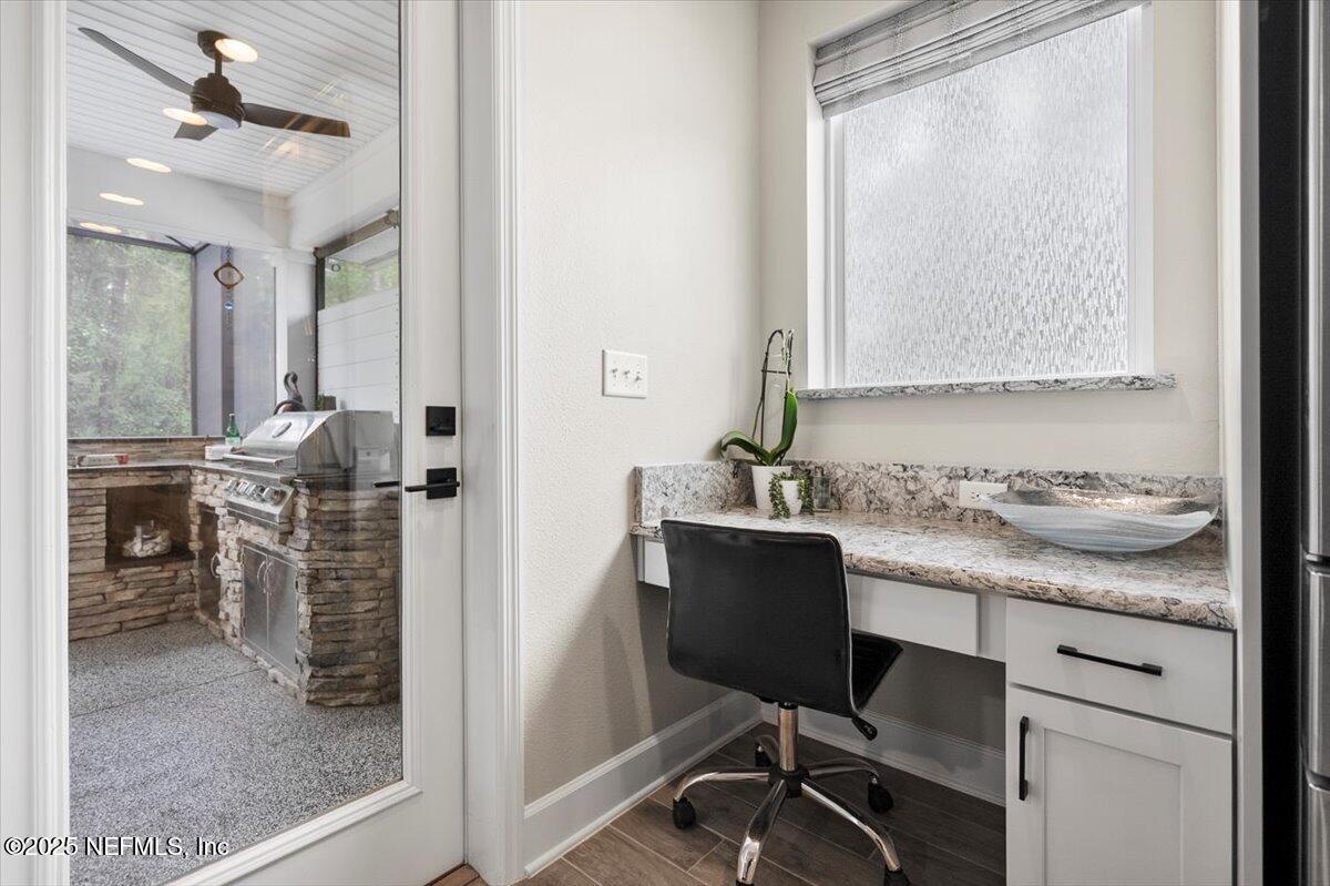 174 Beartooth Trail Ponte Vedra, FL 32081 - Photo 13 of 29 a view of a workspace room with wooden floor and windows