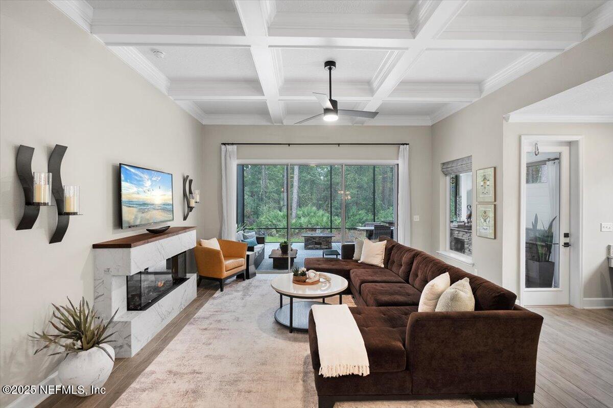 174 Beartooth Trail Ponte Vedra, FL 32081 - Photo 14 of 29 a living room with furniture and a flat screen tv