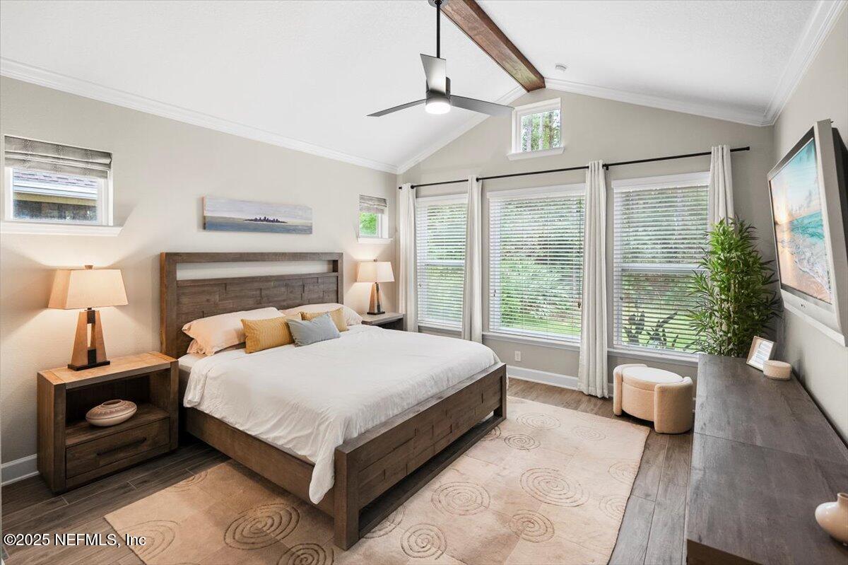 174 Beartooth Trail Ponte Vedra, FL 32081 - Photo 15 of 29 a bedroom with a large bed and a large window