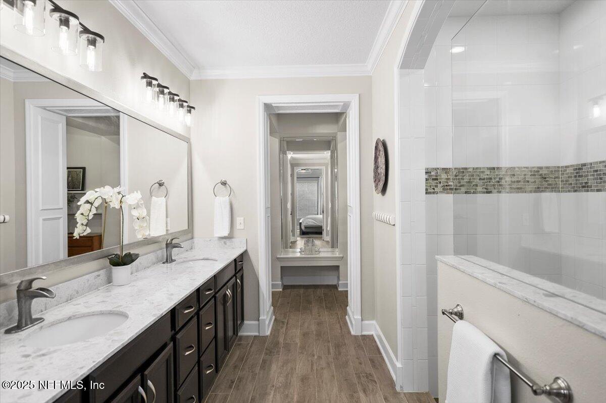 174 Beartooth Trail Ponte Vedra, FL 32081 - Photo 16 of 29 a bathroom with a granite countertop sink a large mirror and shower