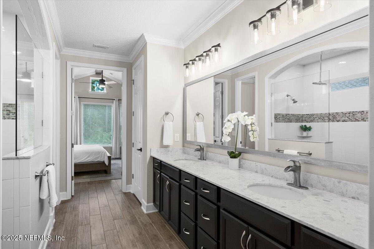 174 Beartooth Trail Ponte Vedra, FL 32081 - Photo 17 of 29 a bathroom with double vanity sinks and a mirror