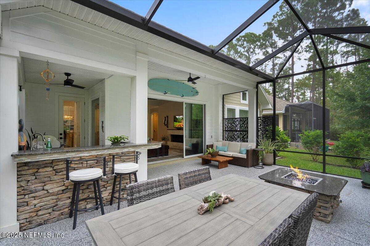 174 Beartooth Trail Ponte Vedra, FL 32081 - Photo 18 of 29 a living room with patio furniture and a garden