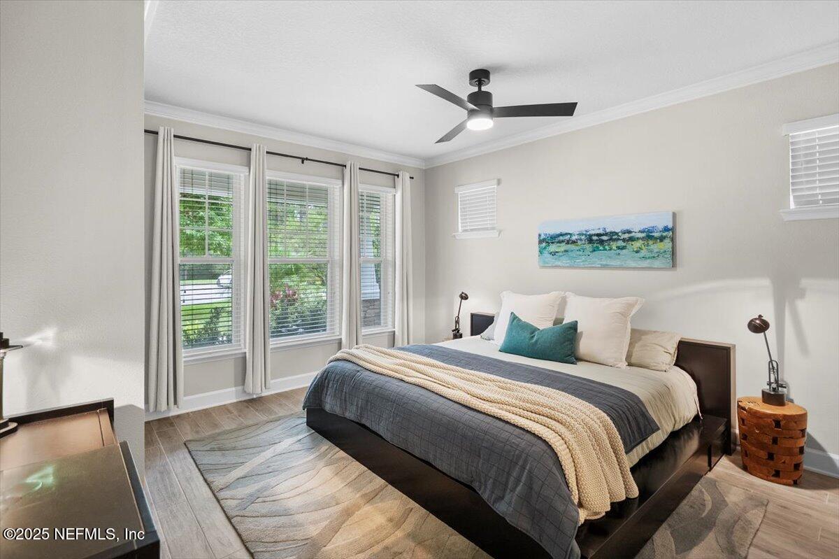 174 Beartooth Trail Ponte Vedra, FL 32081 - Photo 5 of 29 a bedroom with a large bed and a large window