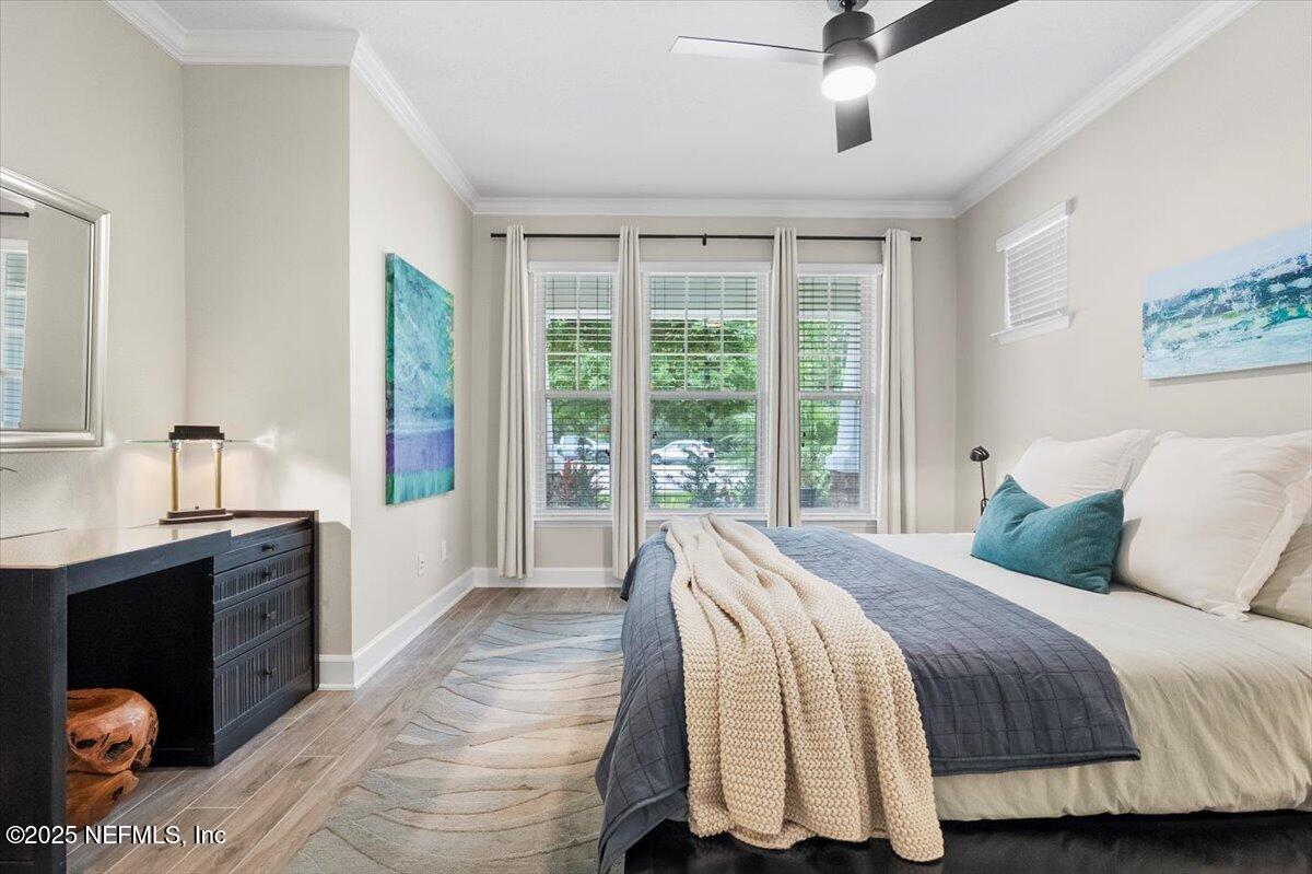 174 Beartooth Trail Ponte Vedra, FL 32081 - Photo 6 of 29 a bedroom with a large bed and a balcony