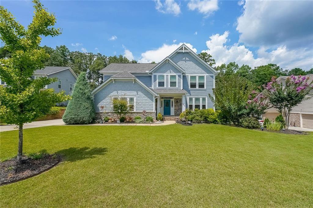 a front view of a house with garden