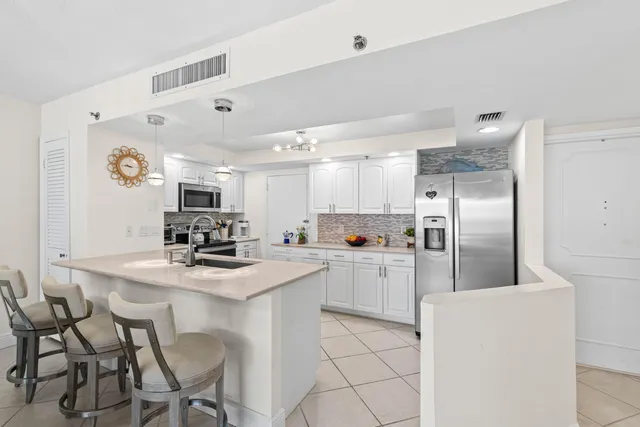 $695,000 | 4750 South Ocean Boulevard, Unit 202, Highland Beach, FL 33487