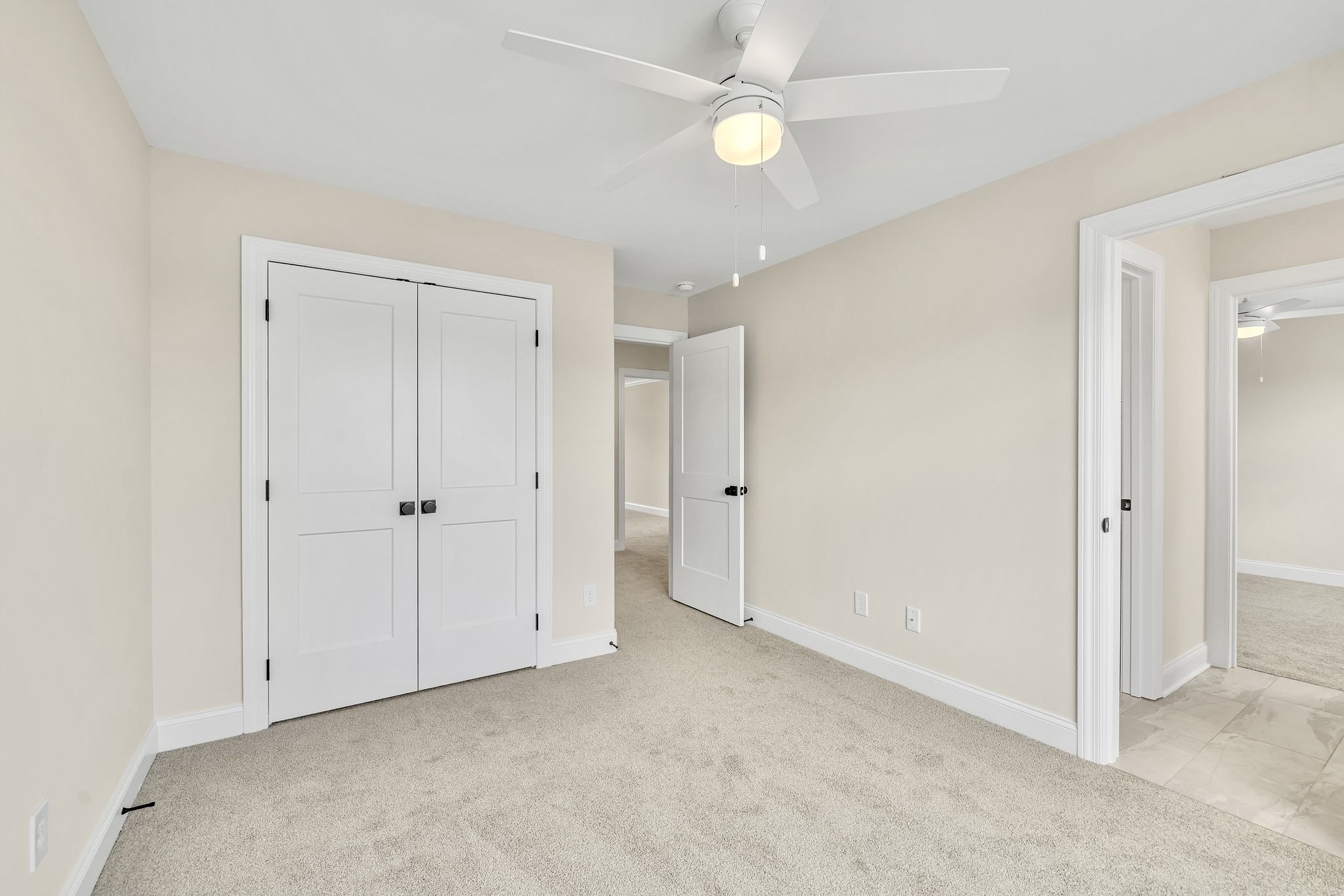 1917 Gracie Bug Loop Murfreesboro, TN 37128 - Photo 13 of 27 a view of an empty room with a ceiling fan