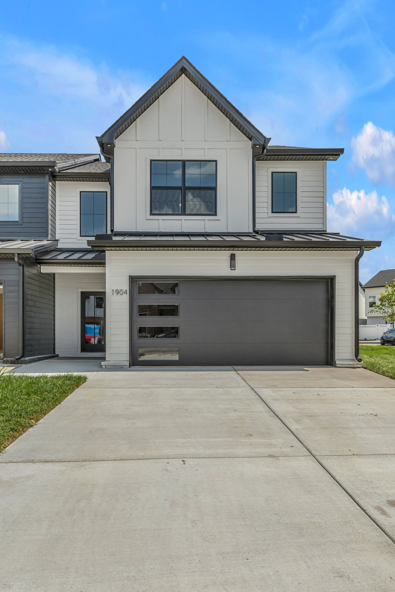 1917 Gracie Bug Loop Murfreesboro, TN 37128 - Photo 21 of 27 a front view of a house with a yard and garage