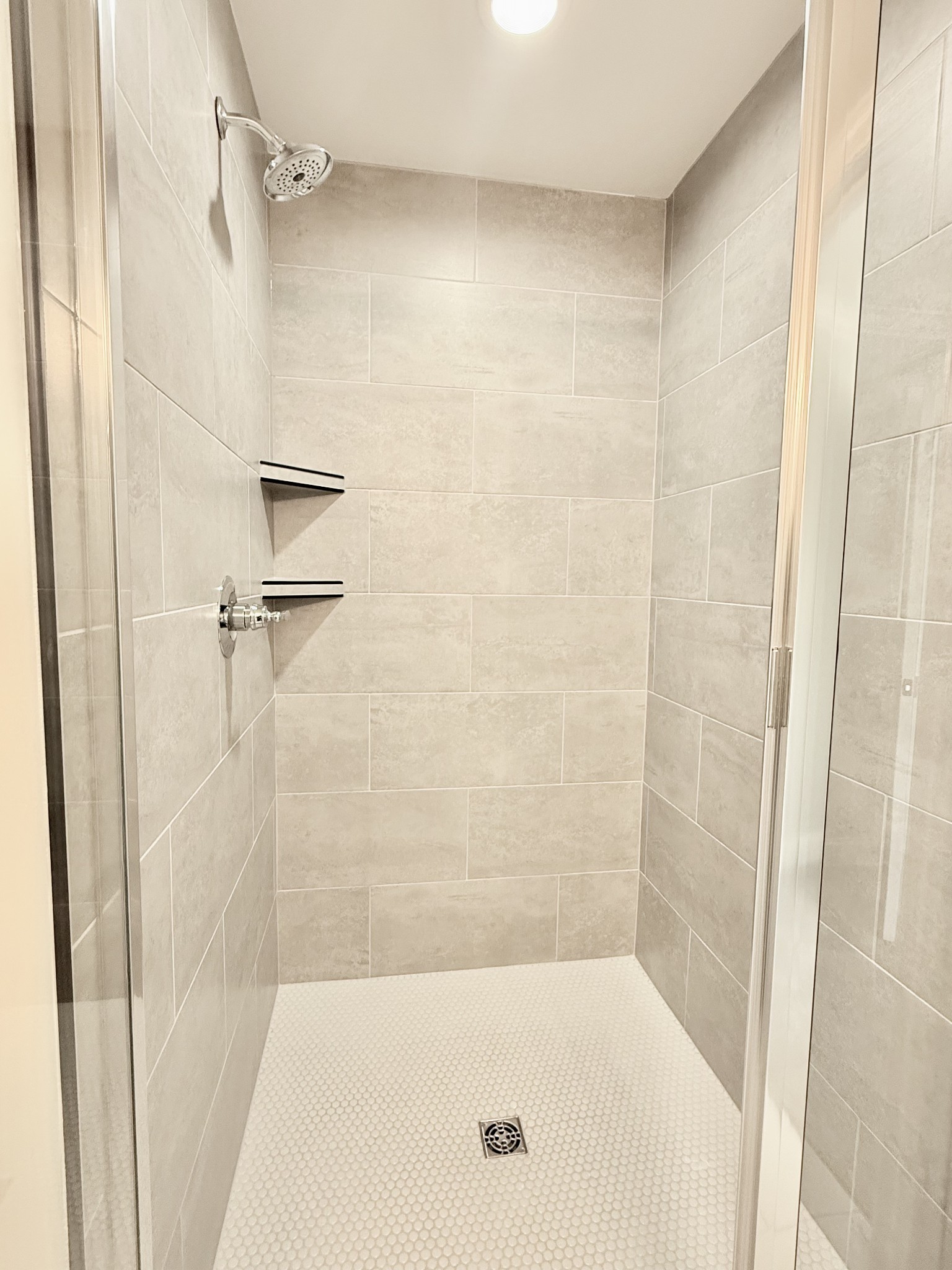 1917 Gracie Bug Loop Murfreesboro, TN 37128 - Photo 7 of 27 a bathroom with a shower and a bath tub