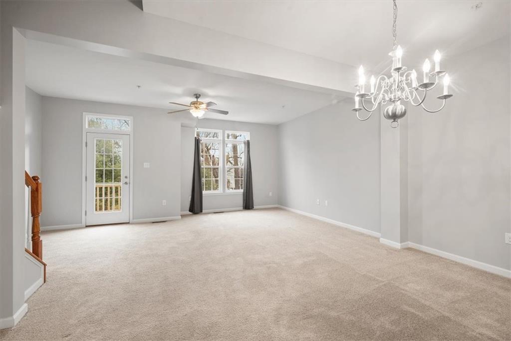 115 Lewisham Road Cranberry Township, PA 16066 - Photo 14 of 38 a view of a livingroom with a chandelier fan and windows