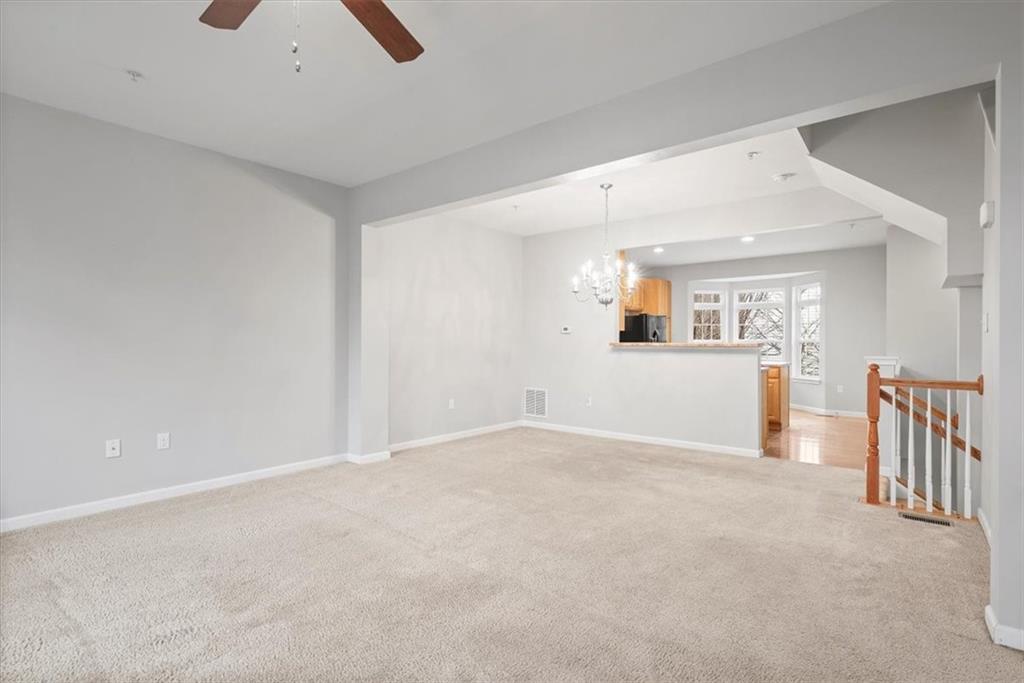 115 Lewisham Road Cranberry Township, PA 16066 - Photo 16 of 38 an empty room with wooden floor and windows