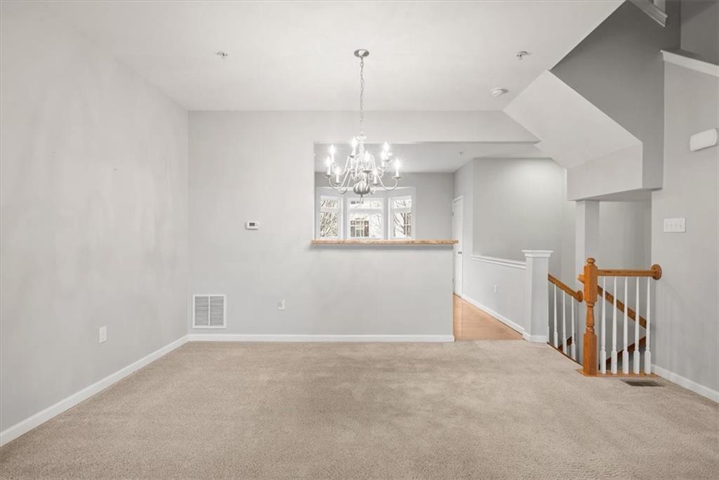 115 Lewisham Road Cranberry Township, PA 16066 - Photo 17 of 38 a view of a hallway with windows and chandelier