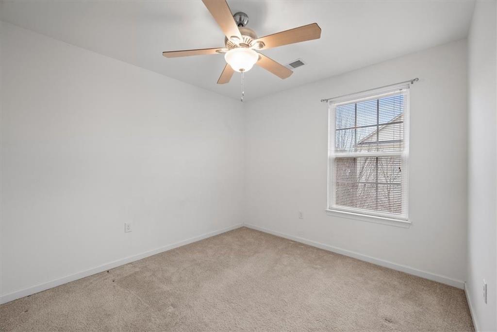 115 Lewisham Road Cranberry Township, PA 16066 - Photo 32 of 38 an empty room with chandelier fan and windows