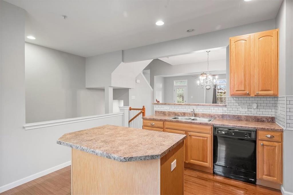 115 Lewisham Road Cranberry Township, PA 16066 - Photo 7 of 38 a kitchen with stainless steel appliances granite countertop a sink and a stove