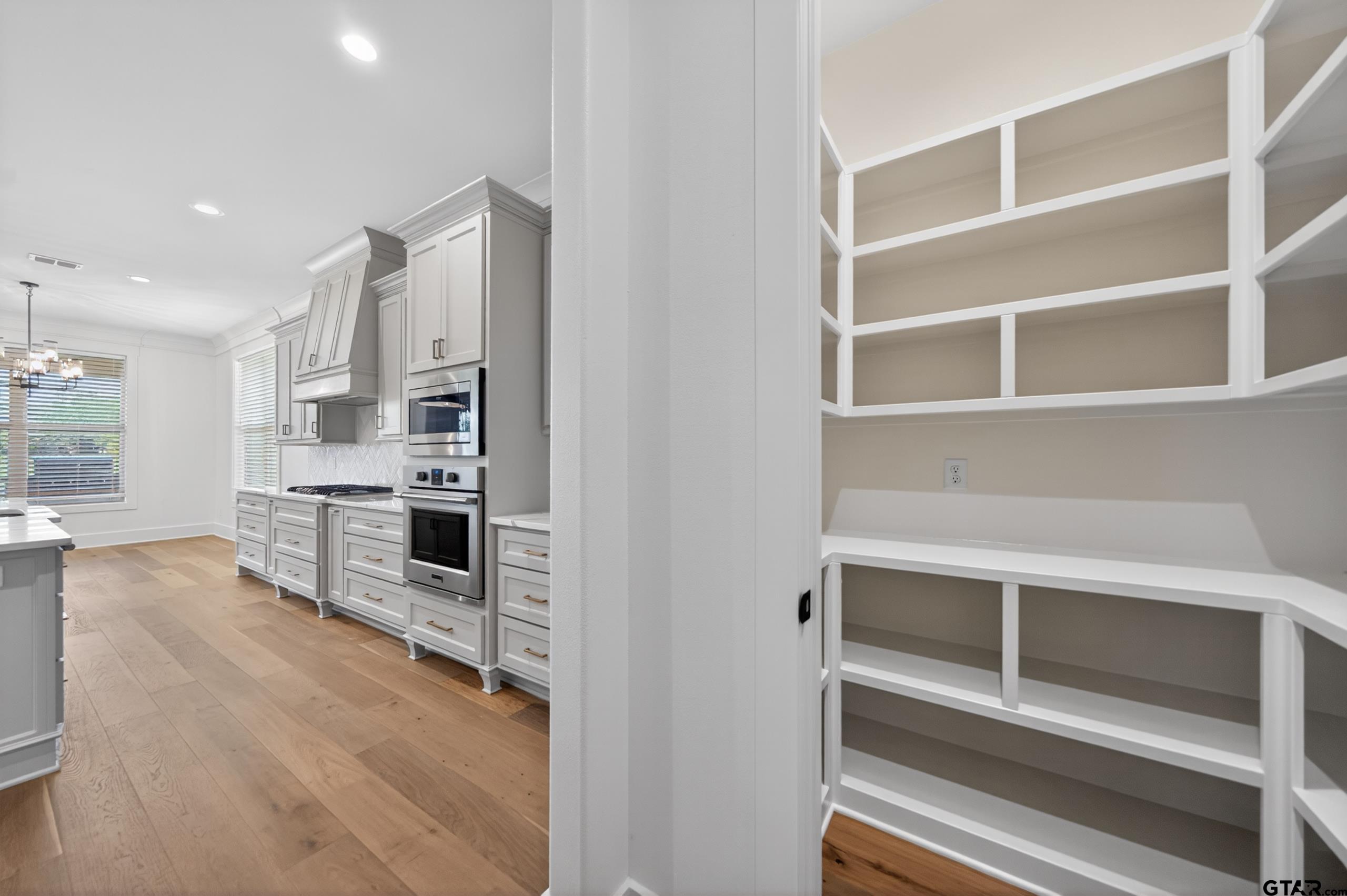 7517 Cross Gate Way Tyler, TX 75703 - Photo 10 of 47 a kitchen with stainless steel appliances and cabinets