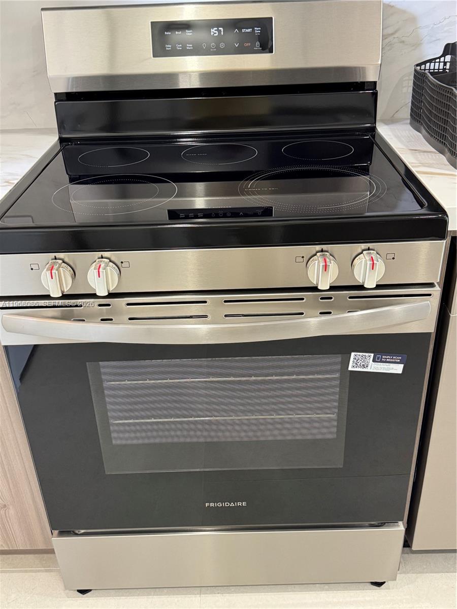 1900 West 54th Street, Unit 219 Hialeah, FL 33012 - Photo 16 of 42 a close view of stove