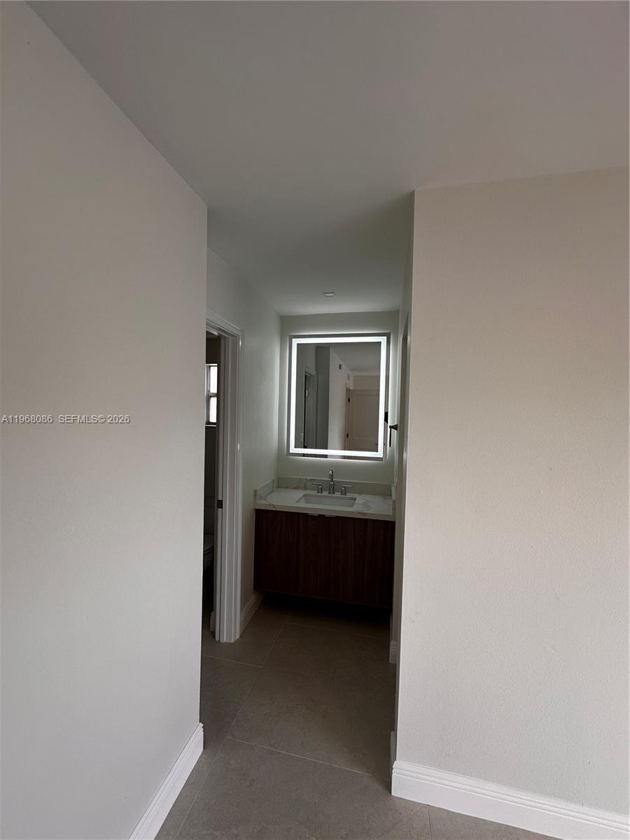 1900 West 54th Street, Unit 219 Hialeah, FL 33012 - Photo 27 of 42 a view of house with entryway