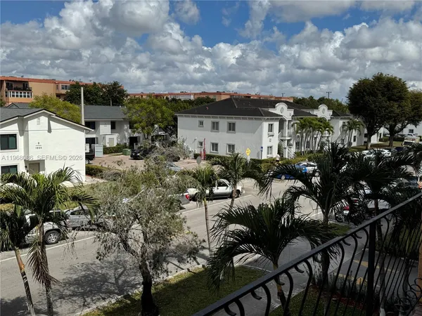 a view of a swimming pool with outdoor seating