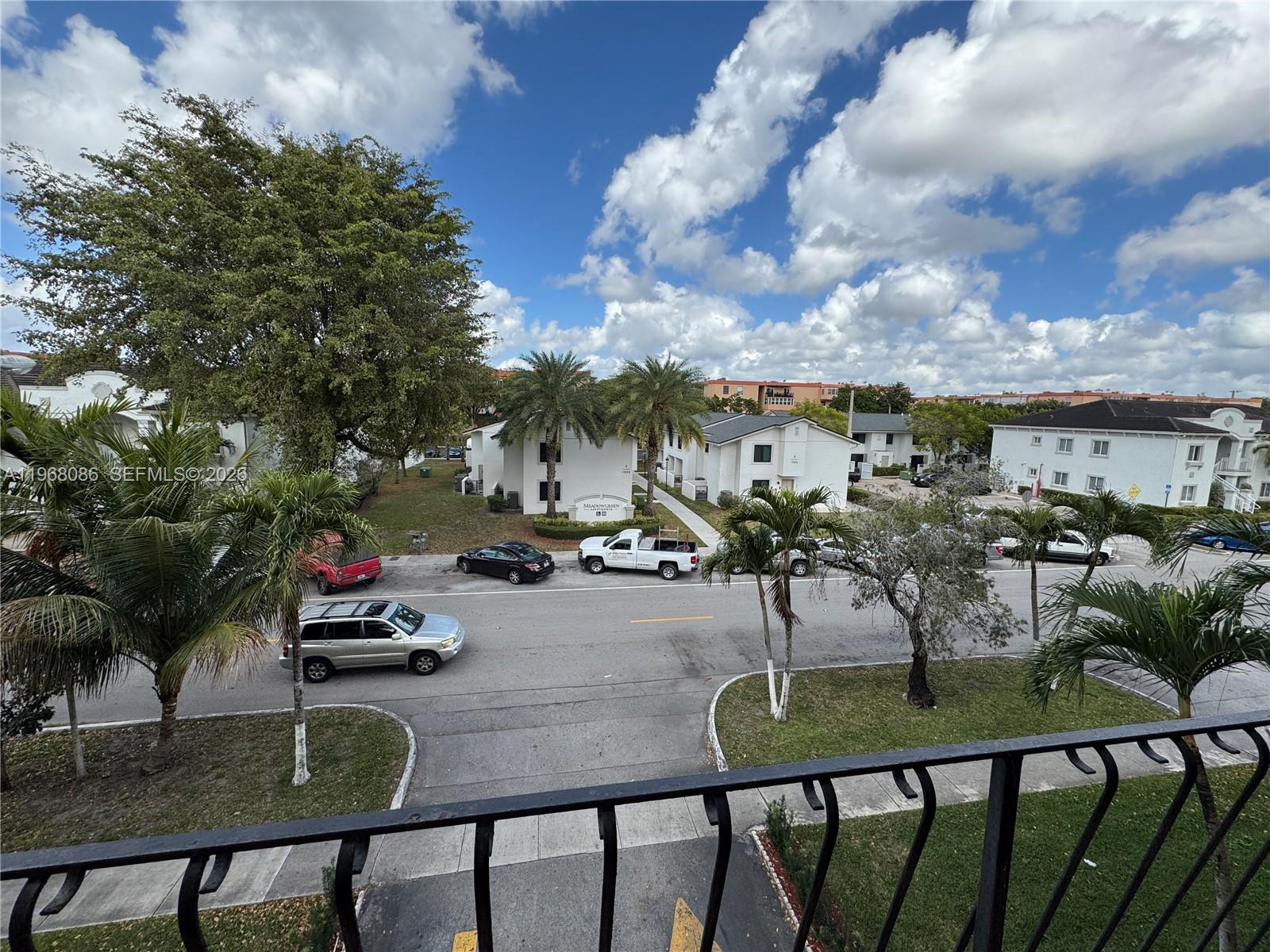 1900 West 54th Street, Unit 219 Hialeah, FL 33012 - Photo 30 of 42 a view of a swimming pool with outdoor seating