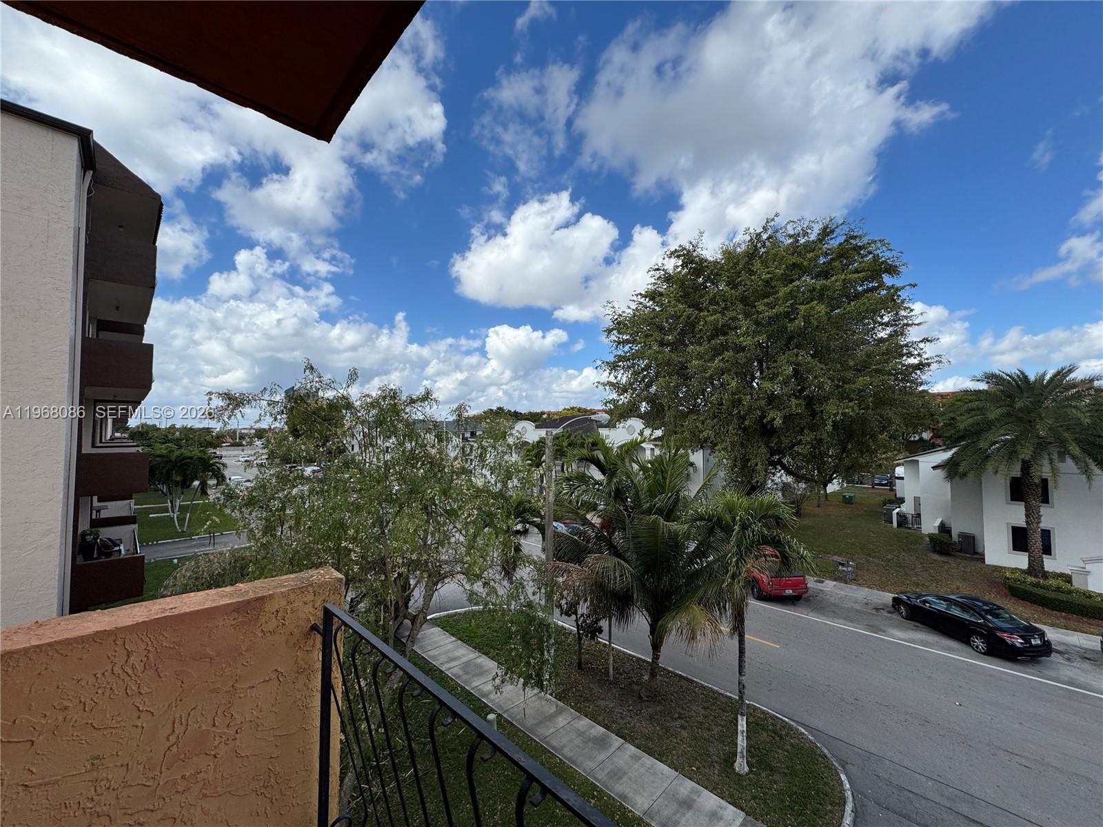 1900 West 54th Street, Unit 219 Hialeah, FL 33012 - Photo 31 of 42 a view of a balcony with an outdoor space
