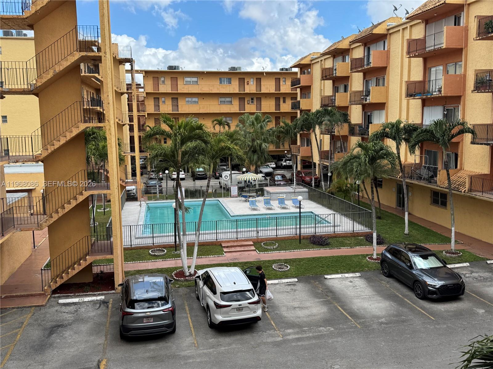 1900 West 54th Street, Unit 219 Hialeah, FL 33012 - Photo 35 of 42 a car parked in front of a building