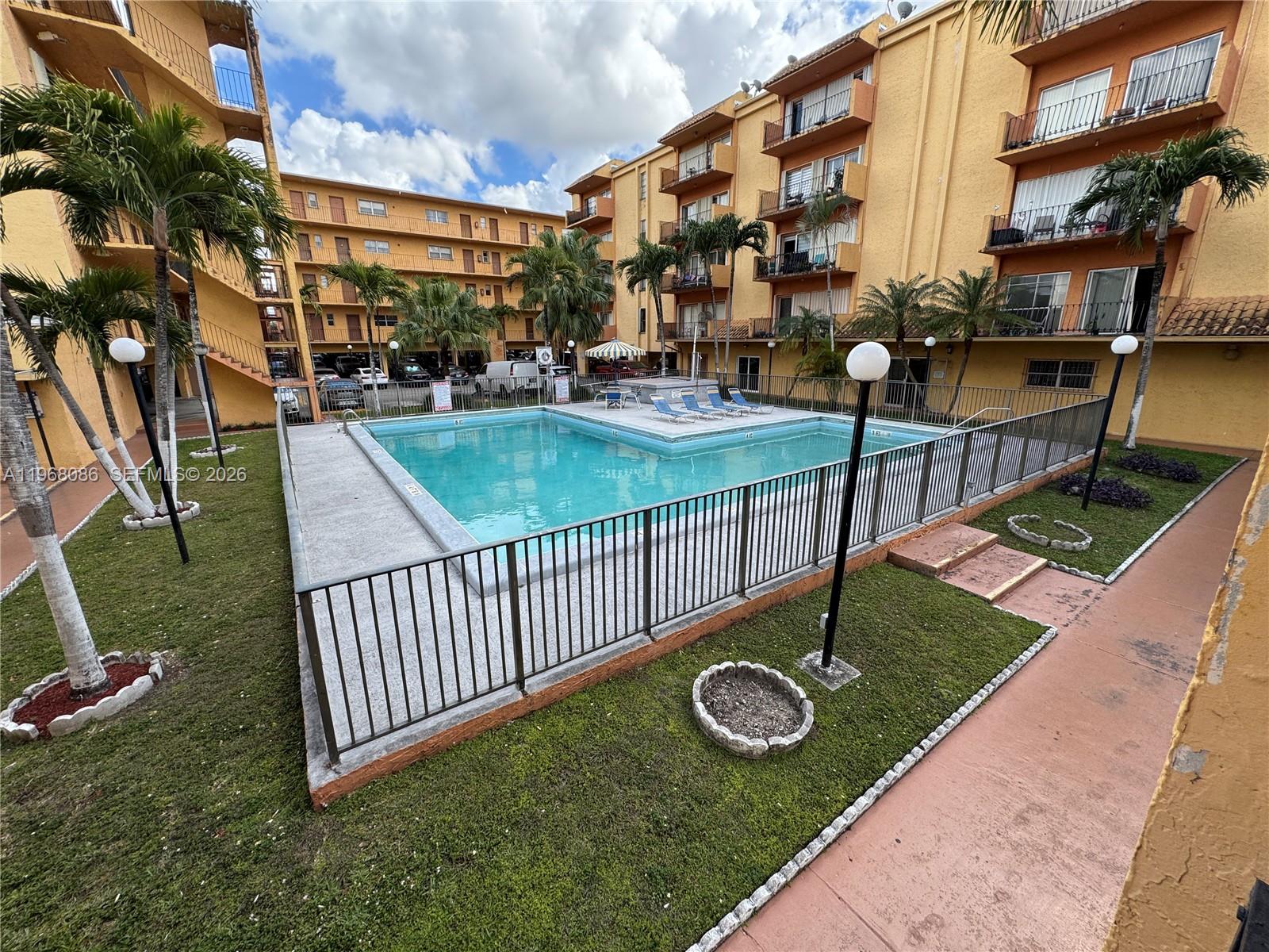 1900 West 54th Street, Unit 219 Hialeah, FL 33012 - Photo 36 of 42 a view of a garden with an outdoor space