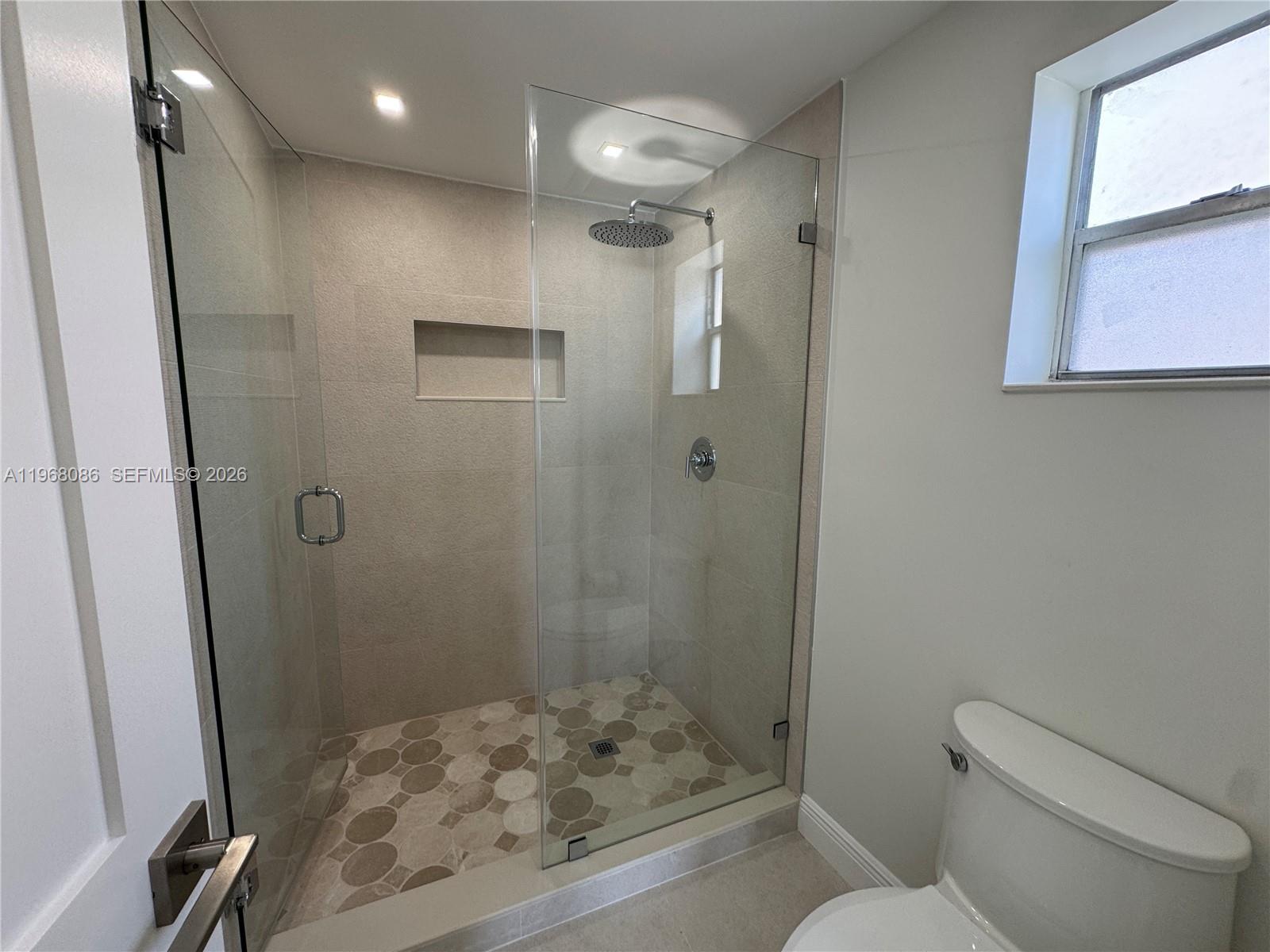 1900 West 54th Street, Unit 219 Hialeah, FL 33012 - Photo 4 of 42 a bathroom with a shower toilet and sink