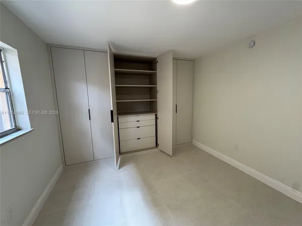 a view of an empty walk in closet