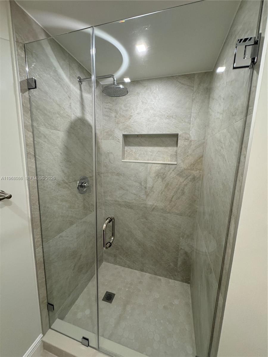 1900 West 54th Street, Unit 219 Hialeah, FL 33012 - Photo 8 of 42 a bathroom with a shower