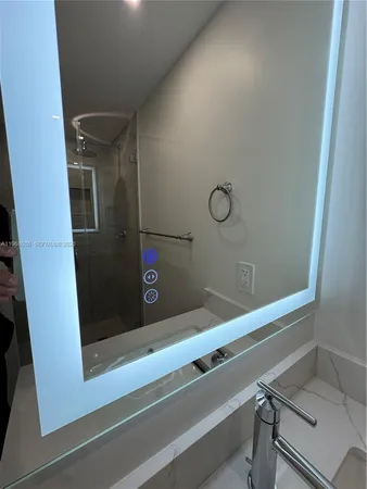 a bathroom with a bathtub and shower