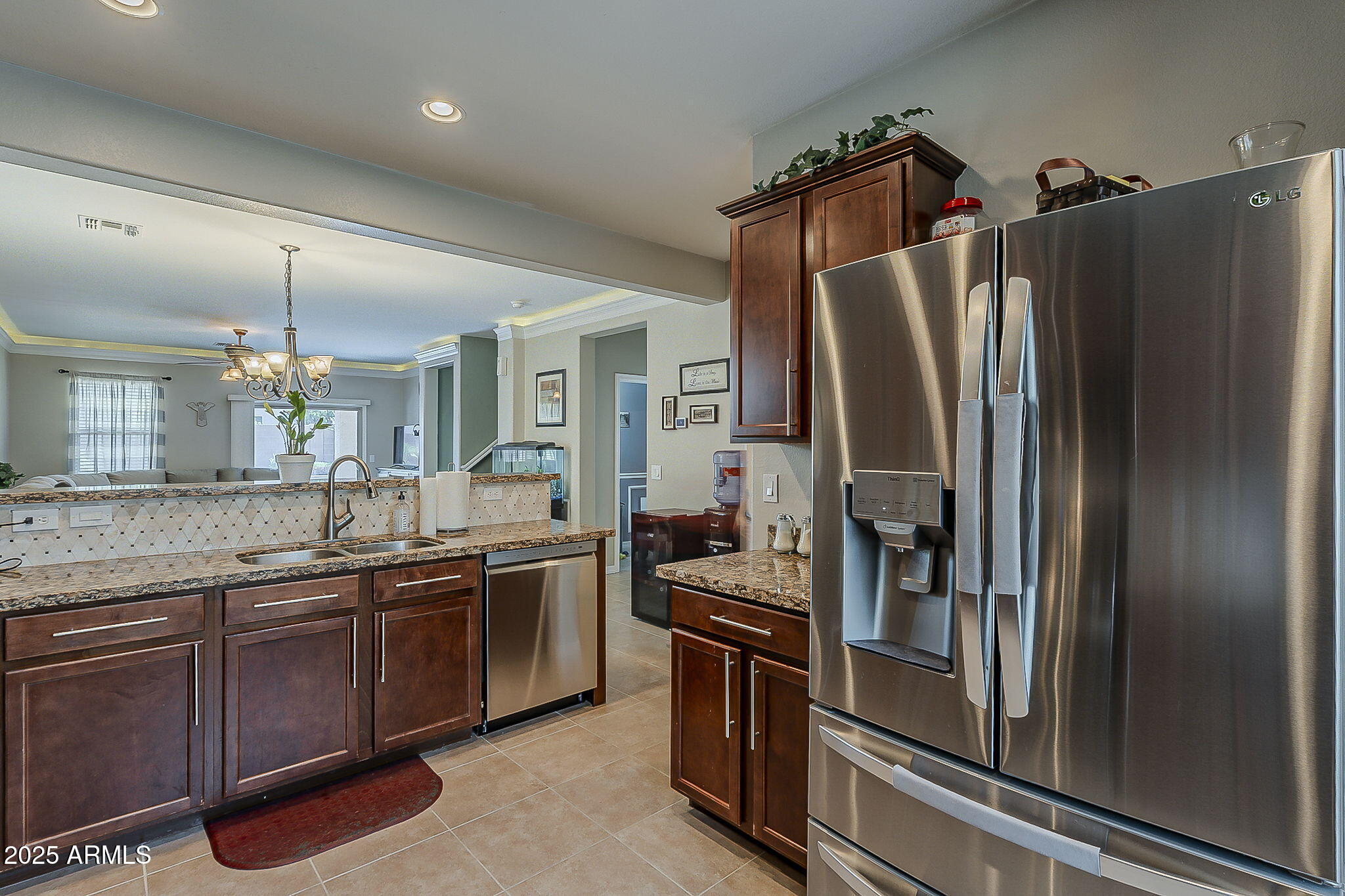 4407 West Crescent Road San Tan Valley, AZ 85144 - Photo 14 of 50 a kitchen with stainless steel appliances granite countertop a refrigerator and a sink