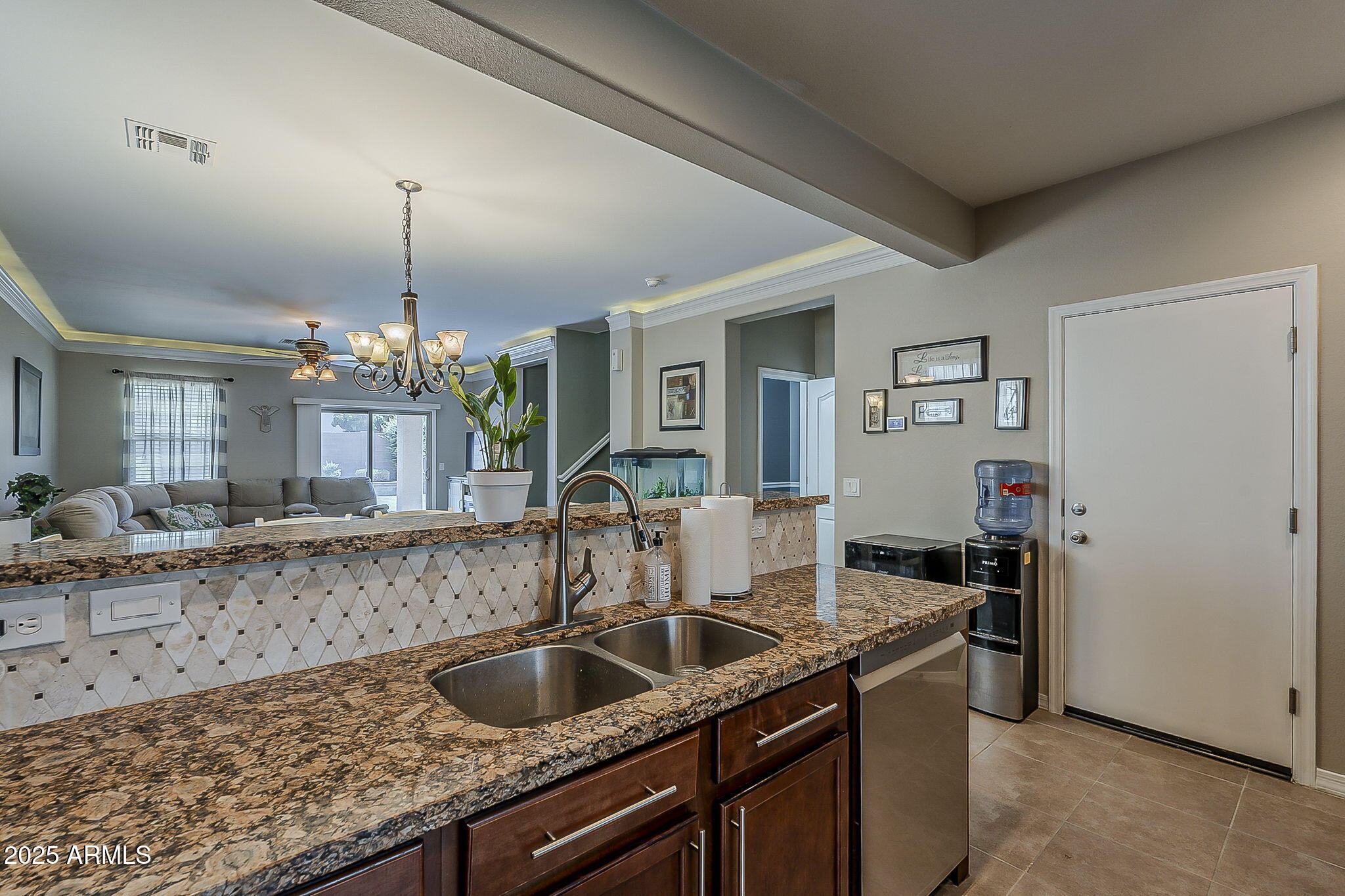 4407 West Crescent Road San Tan Valley, AZ 85144 - Photo 15 of 50 a kitchen with granite countertop a sink and a refrigerator