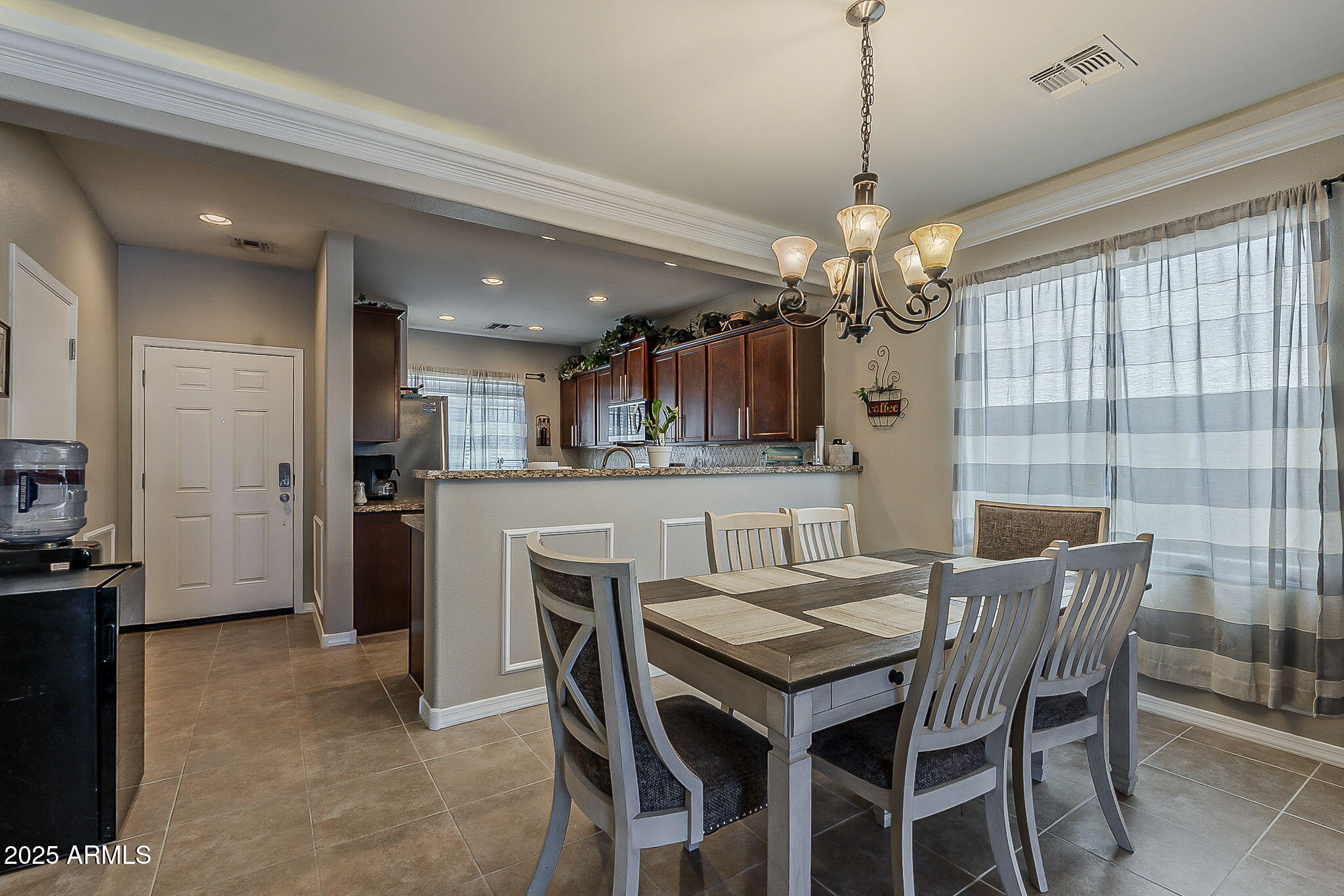 4407 West Crescent Road San Tan Valley, AZ 85144 - Photo 16 of 50 a dining room with furniture and chandelier