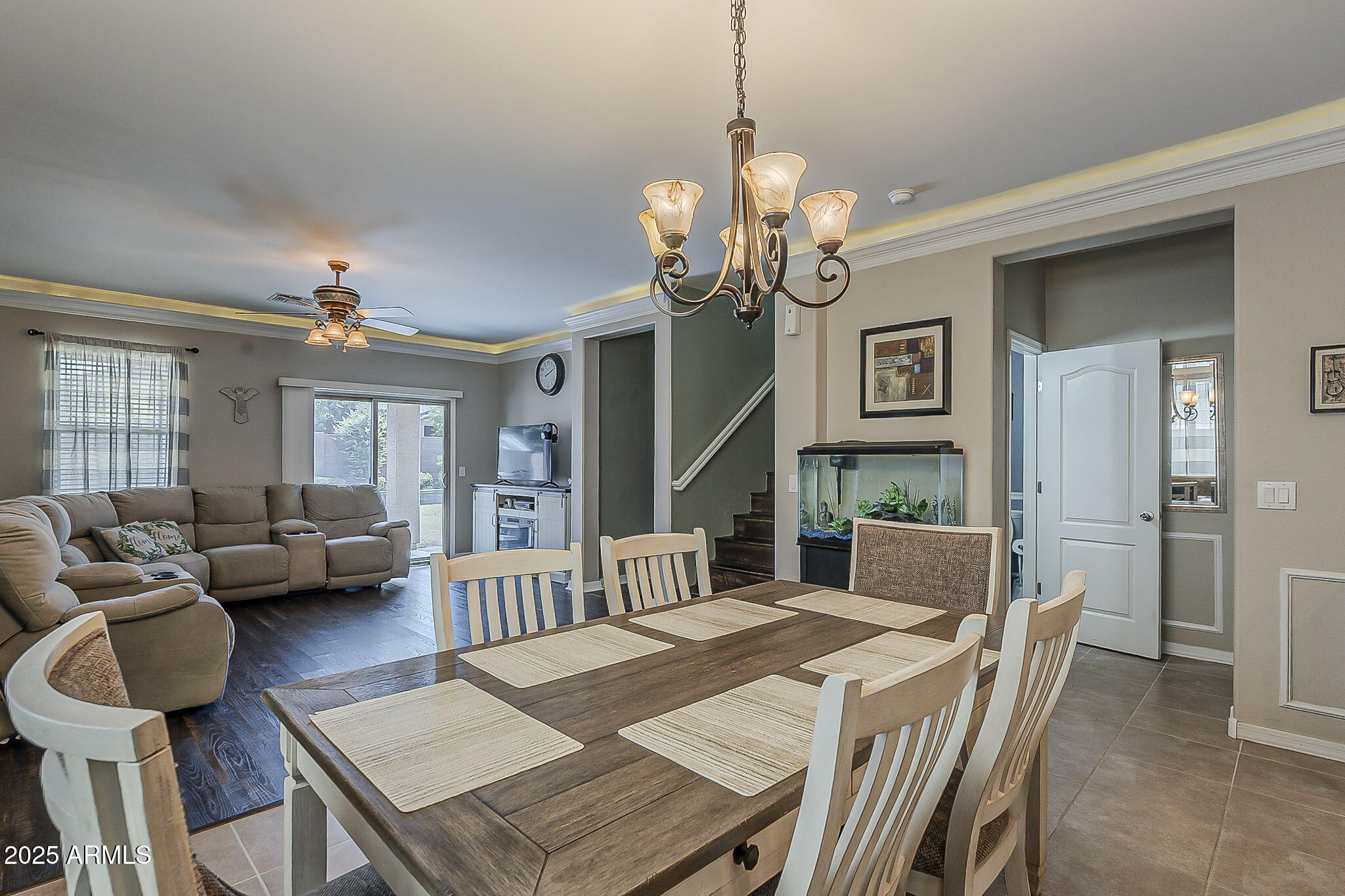 4407 West Crescent Road San Tan Valley, AZ 85144 - Photo 18 of 50 a view of a dining room with furniture a chandelier and wooden floor